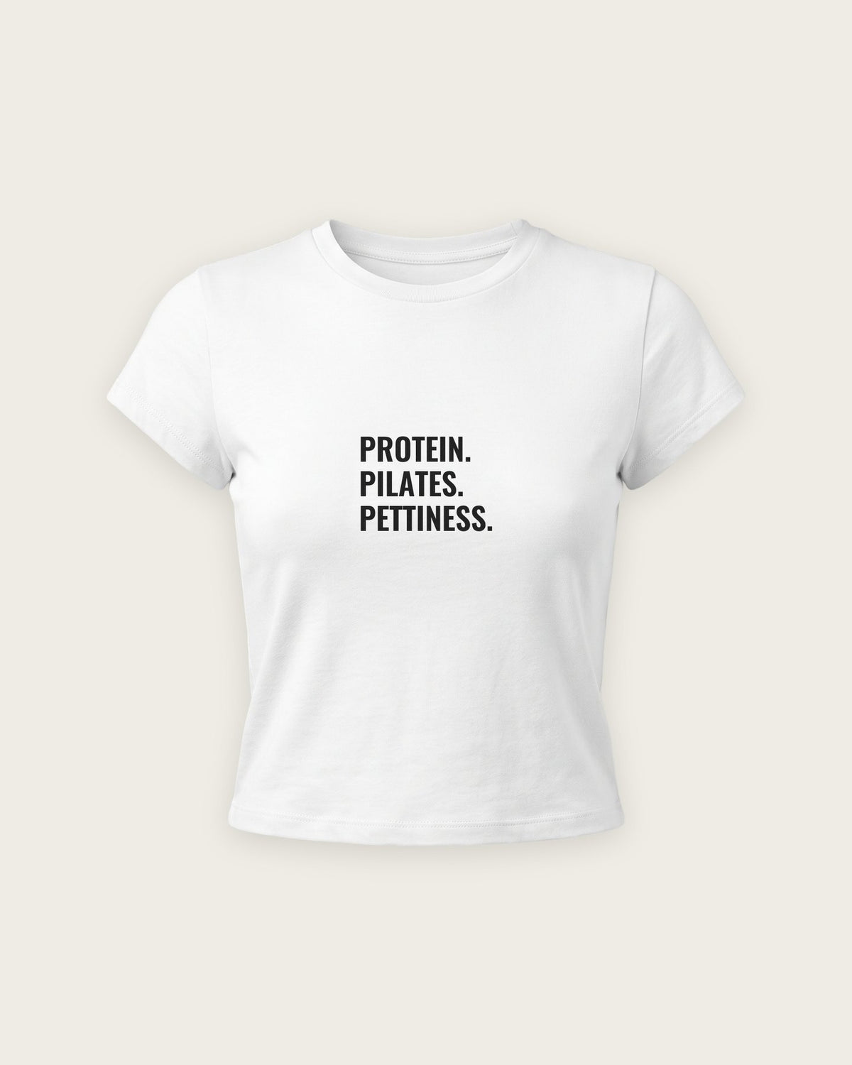Baby Tee “Protein, Pilates, Pettiness” — Branco