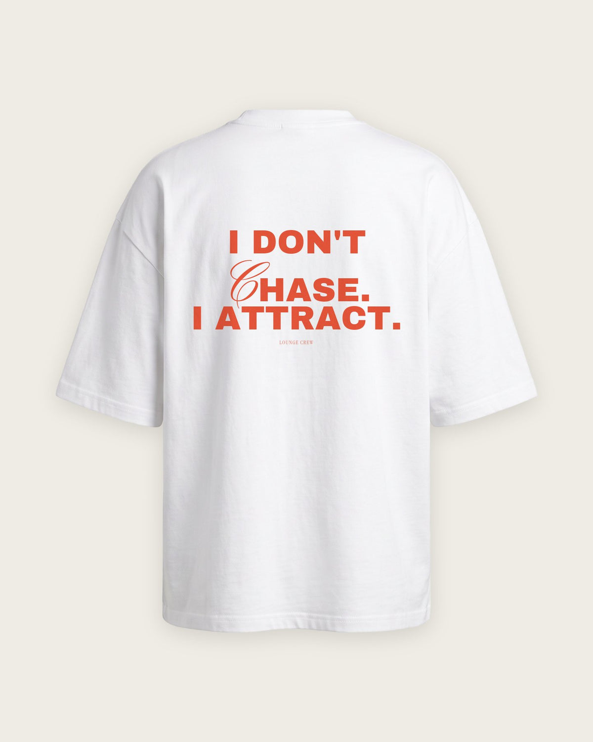 Camiseta Oversized “I Don't Chase, I Attract” — Branco